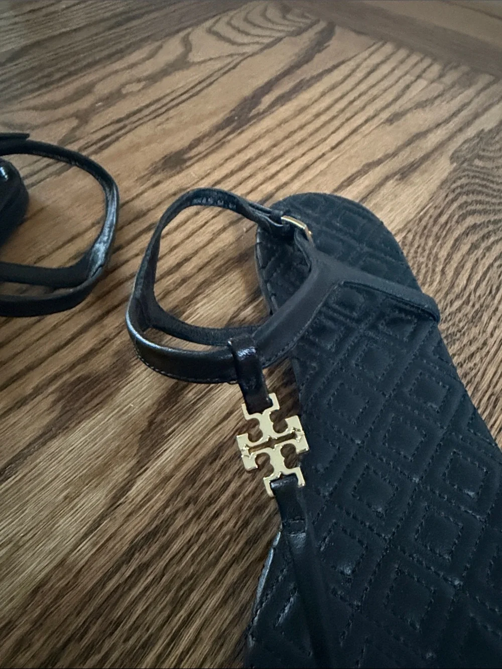 Tory Burch Black Quilted Leather T-Strap Sandals with Gold Logo Hardware